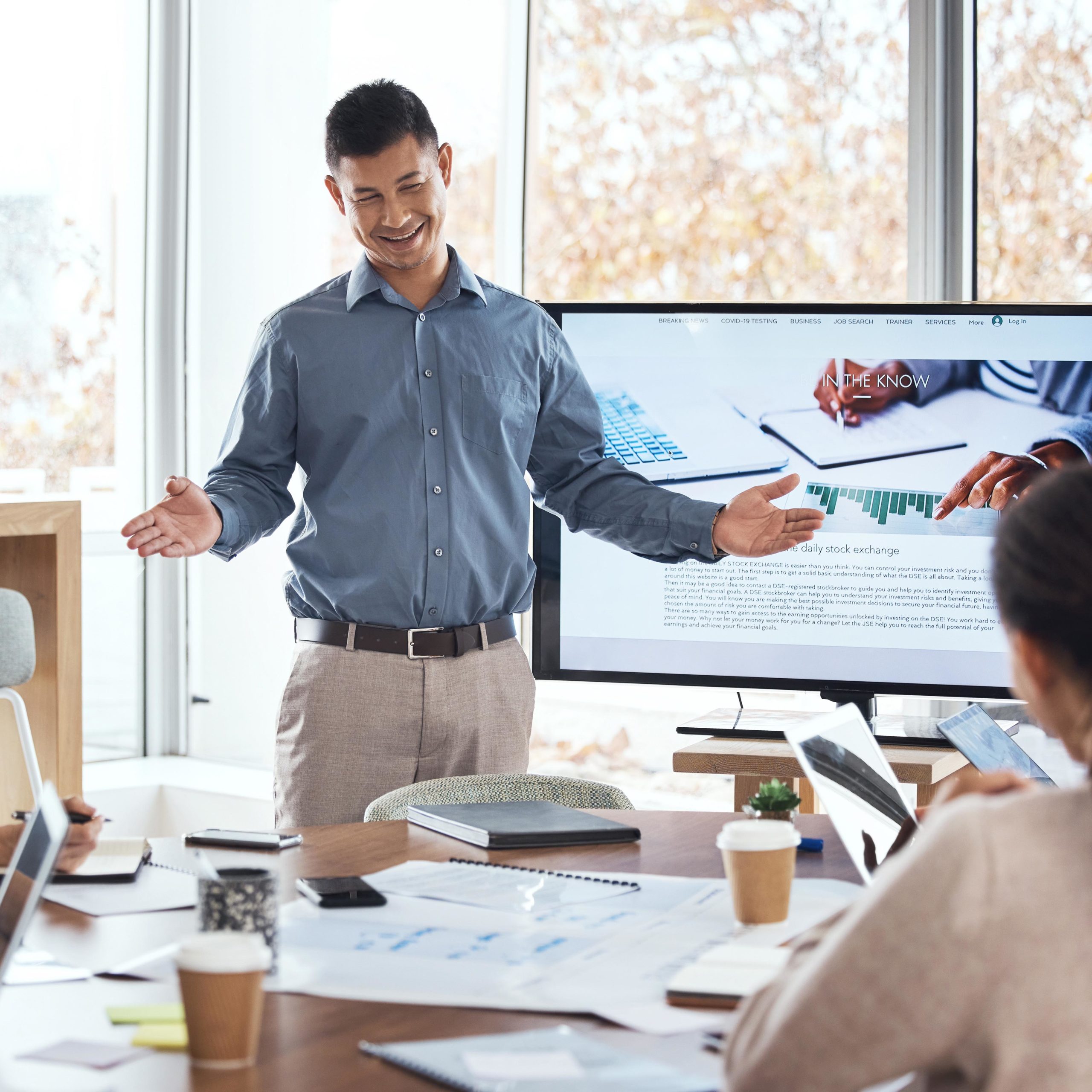 Business presentation, man leader and training for stock exchange and seminar for company growth. Working, research data and workshop of a manager with online investment group in office with tech.